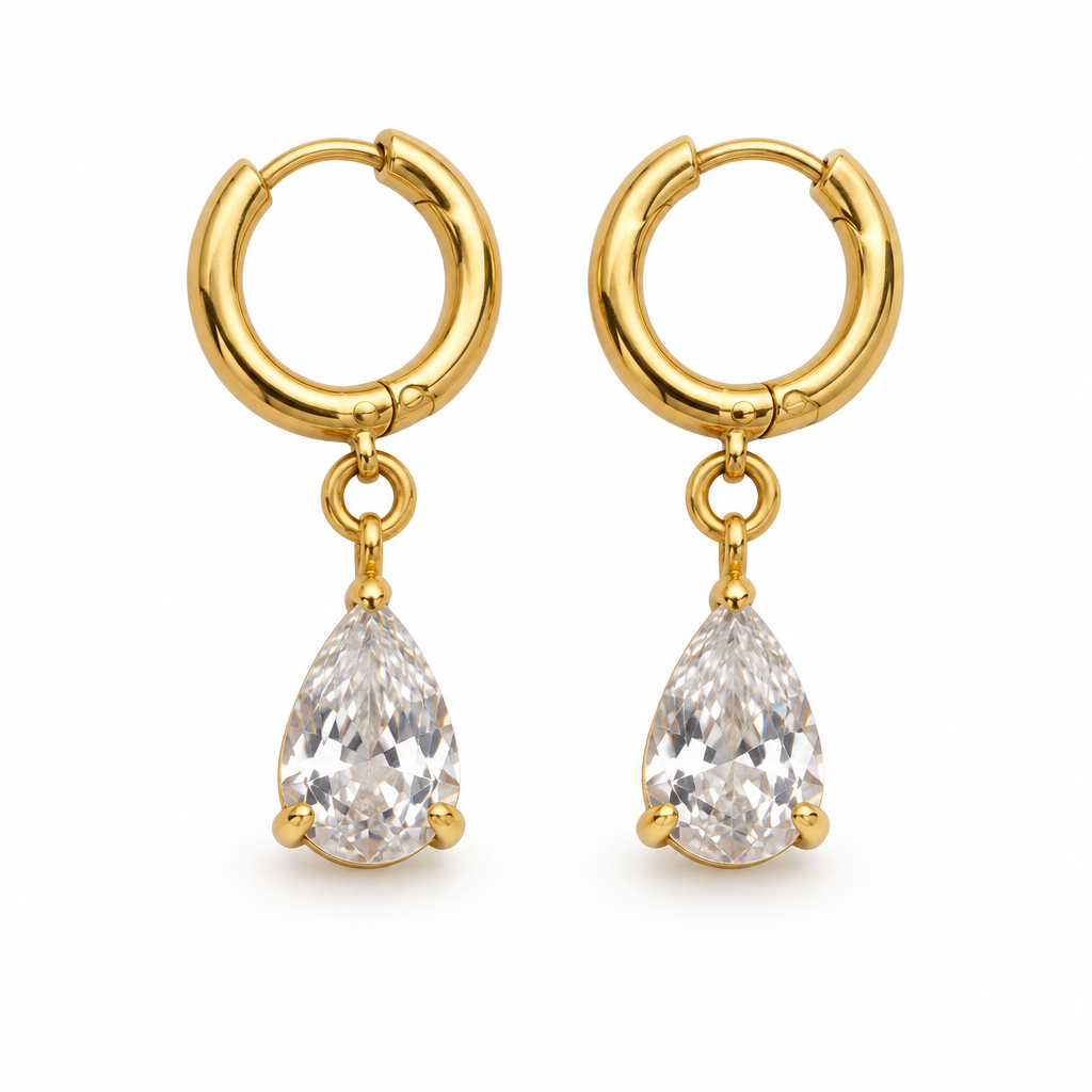 Gold hoop earrings with clear drops on a white background